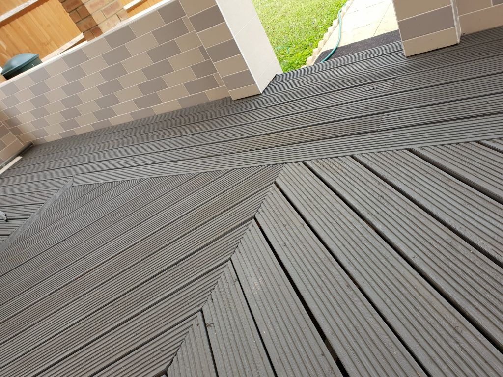 Composite decking herringbone pattern